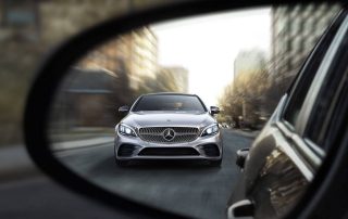 Mercedes SUV in passenger mirror