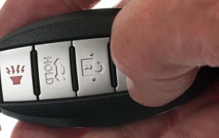 Car Remote Access key being held in hand