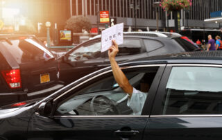 Rideshare driver in a used car in NYC