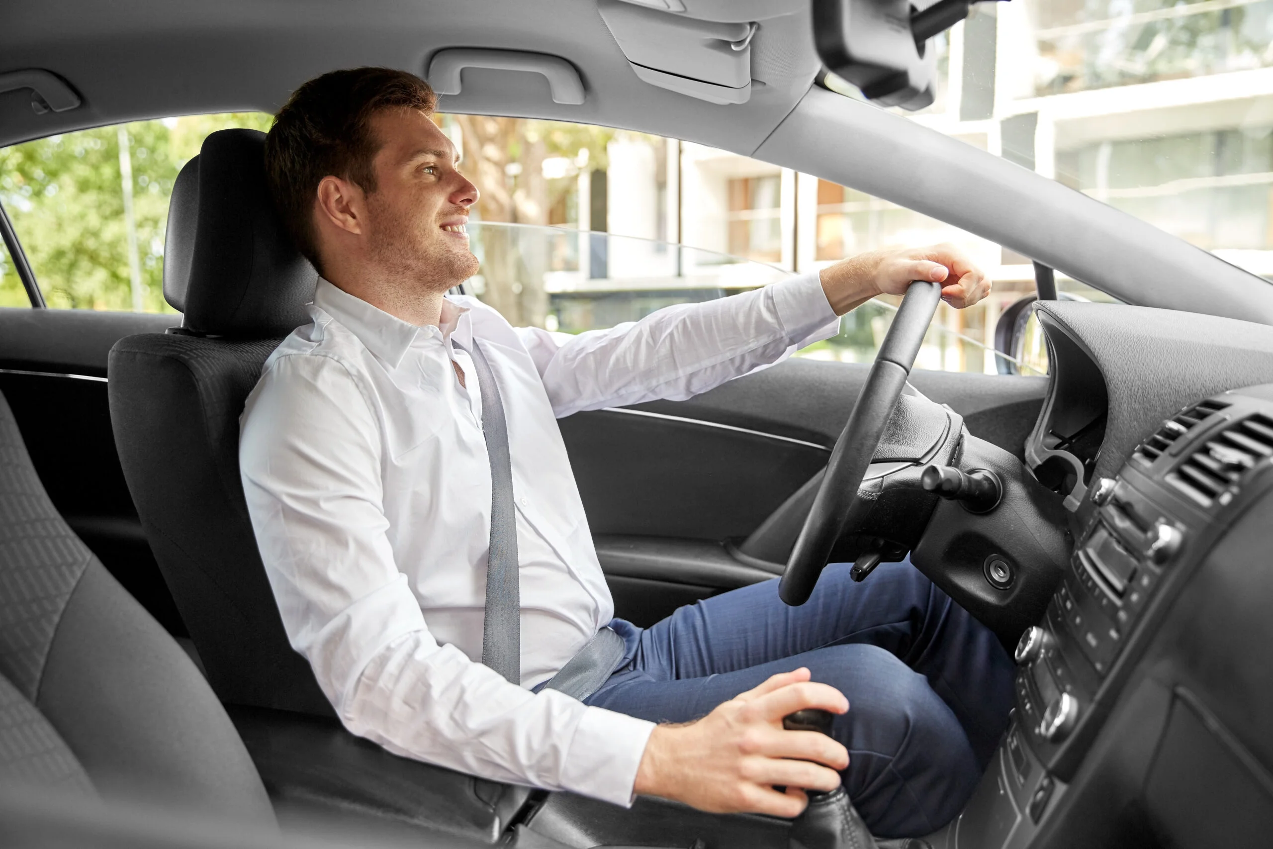 smiling man or driver driving car